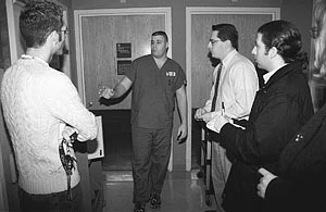 Chris Kelly, radiology technologist, shows cast members some procedures and technology currently in use.